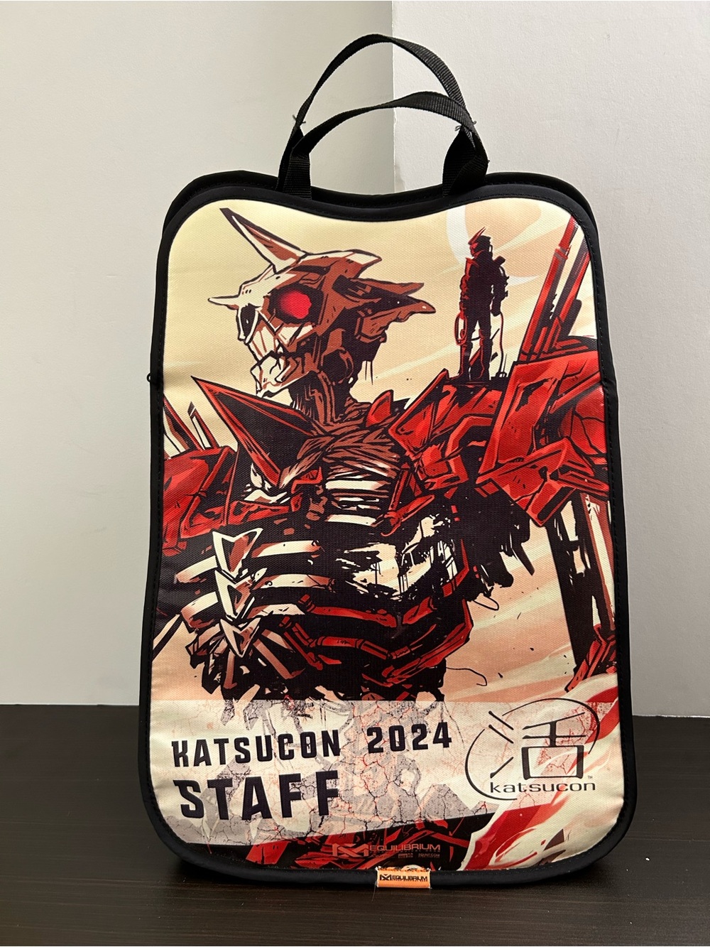 Equilibrium Katsucon 2024 Mecha Anime Staff Bag designed by Sarah Miller